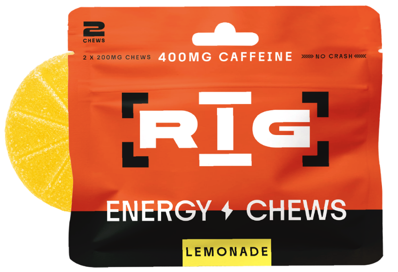 A package of RIG Energy Chews Lemonade flavor, featuring a bright orange and black bag with a yellow lemon slice graphic on the left, indicating two 200mg caffeine chews inside.